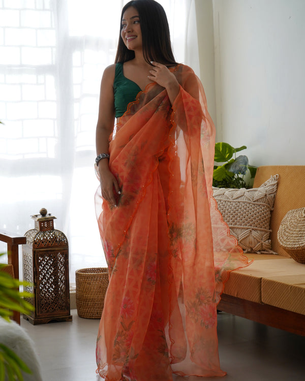 Orange Organza Saree with Artistic Floral Patterns